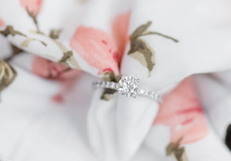 Beautiful Engagement Ring - Posed on Dress - Grey Loft Studio
