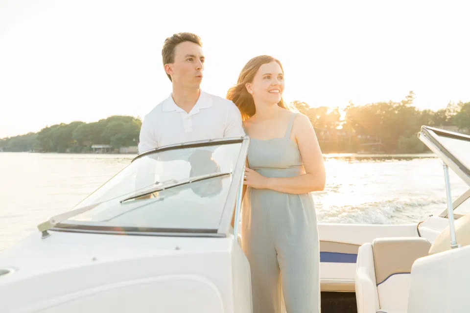 Boat Rides - Ideas for what to wear for Engagement Photography, Modern Engagement Session Inspiration Wardrobe Ideas. Unsure of what to wear for your engagement photos, we've got you! Romantic blue Romper and neutral Shirts and polo. Boat Shoes and Flip Flops. Engagement in Gananoque. Grey Loft Studio is Ottawa's Wedding and Engagement Photographer Videographer for Real couples, showcasing photos that are modern, bright, and fun.