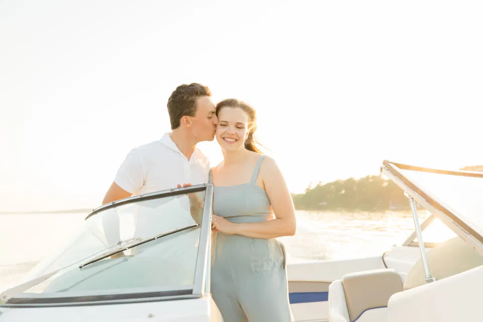Boat Rides - Ideas for what to wear for Engagement Photography, Modern Engagement Session Inspiration Wardrobe Ideas. Unsure of what to wear for your engagement photos, we've got you! Romantic blue Romper and neutral Shirts and polo. Boat Shoes and Flip Flops. Engagement in Gananoque. Grey Loft Studio is Ottawa's Wedding and Engagement Photographer Videographer for Real couples, showcasing photos that are modern, bright, and fun.