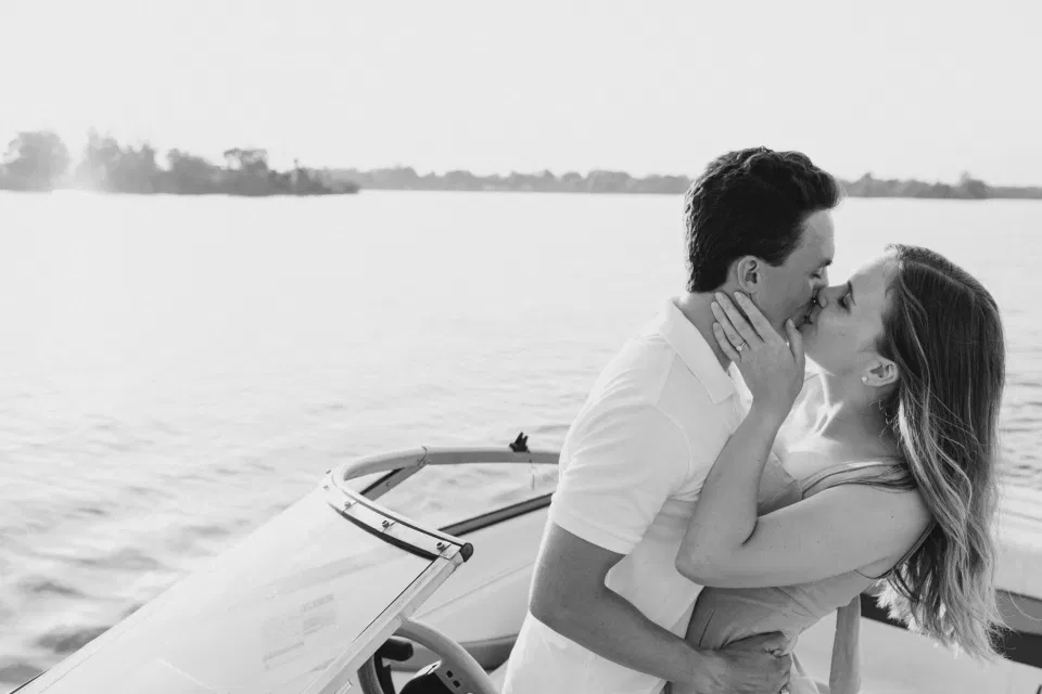 Boat Rides - Ideas for what to wear for Engagement Photography, Modern Engagement Session Inspiration Wardrobe Ideas. Unsure of what to wear for your engagement photos, we've got you! Romantic blue Romper and neutral Shirts and polo. Boat Shoes and Flip Flops. Engagement in Gananoque. Grey Loft Studio is Ottawa's Wedding and Engagement Photographer Videographer for Real couples, showcasing photos that are modern, bright, and fun.