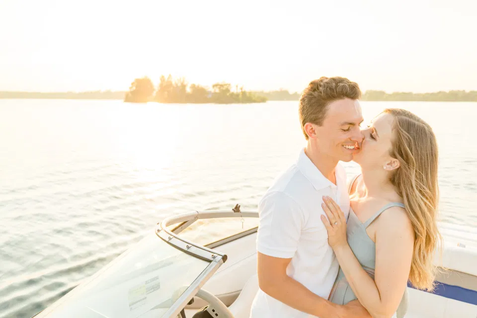 Boat Rides - Ideas for what to wear for Engagement Photography, Modern Engagement Session Inspiration Wardrobe Ideas. Unsure of what to wear for your engagement photos, we've got you! Romantic blue Romper and neutral Shirts and polo. Boat Shoes and Flip Flops. Engagement in Gananoque. Grey Loft Studio is Ottawa's Wedding and Engagement Photographer Videographer for Real couples, showcasing photos that are modern, bright, and fun.