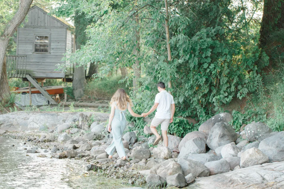 Ideas for what to wear for Engagement Photography, Modern Engagement Session Inspiration Wardrobe Ideas. Unsure of what to wear for your engagement photos, we've got you! Romantic blue Romper and neutral Shirts and polo. Boat Shoes and Flip Flops. Engagement in Gananoque. Grey Loft Studio is Ottawa's Wedding and Engagement Photographer Videographer for Real couples, showcasing photos that are modern, bright, and fun.