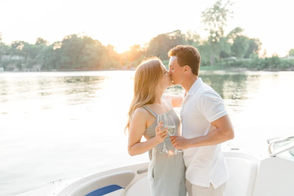 Boat Rides - Ideas for what to wear for Engagement Photography, Modern Engagement Session Inspiration Wardrobe Ideas. Unsure of what to wear for your engagement photos, we've got you! Romantic blue Romper and neutral Shirts and polo. Boat Shoes and Flip Flops. Engagement in Gananoque. Grey Loft Studio is Ottawa's Wedding and Engagement Photographer Videographer for Real couples, showcasing photos that are modern, bright, and fun.