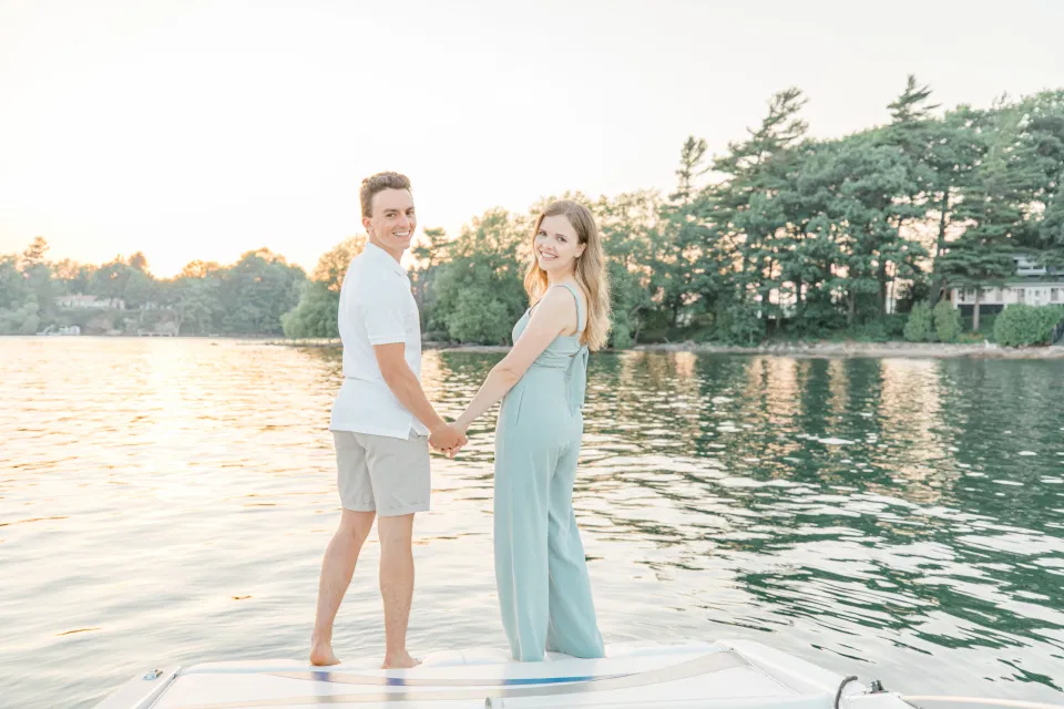 Boat Rides - Ideas for what to wear for Engagement Photography, Modern Engagement Session Inspiration Wardrobe Ideas. Unsure of what to wear for your engagement photos, we've got you! Romantic blue Romper and neutral Shirts and polo. Boat Shoes and Flip Flops. Engagement in Gananoque. Grey Loft Studio is Ottawa's Wedding and Engagement Photographer Videographer for Real couples, showcasing photos that are modern, bright, and fun.