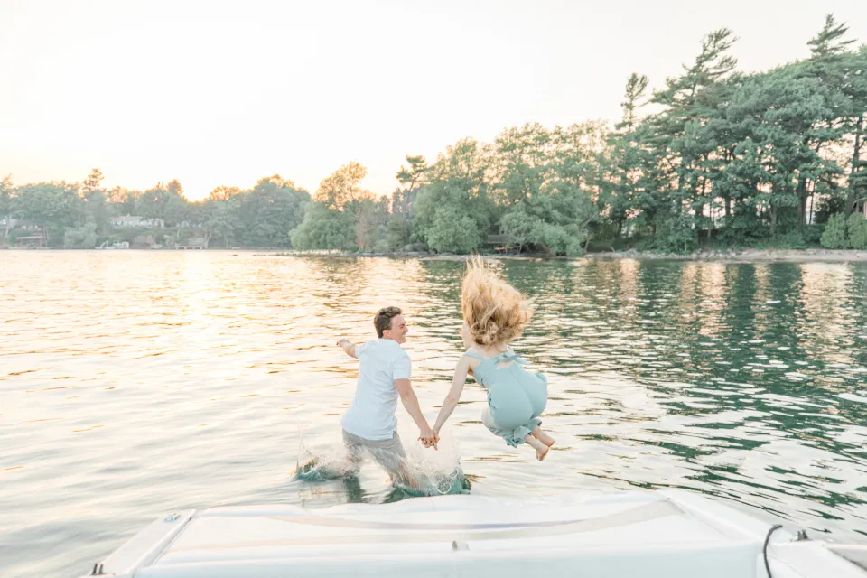 Boat Rides - Ideas for what to wear for Engagement Photography, Modern Engagement Session Inspiration Wardrobe Ideas. Unsure of what to wear for your engagement photos, we've got you! Romantic blue Romper and neutral Shirts and polo. Boat Shoes and Flip Flops. Engagement in Gananoque. Grey Loft Studio is Ottawa's Wedding and Engagement Photographer Videographer for Real couples, showcasing photos that are modern, bright, and fun.