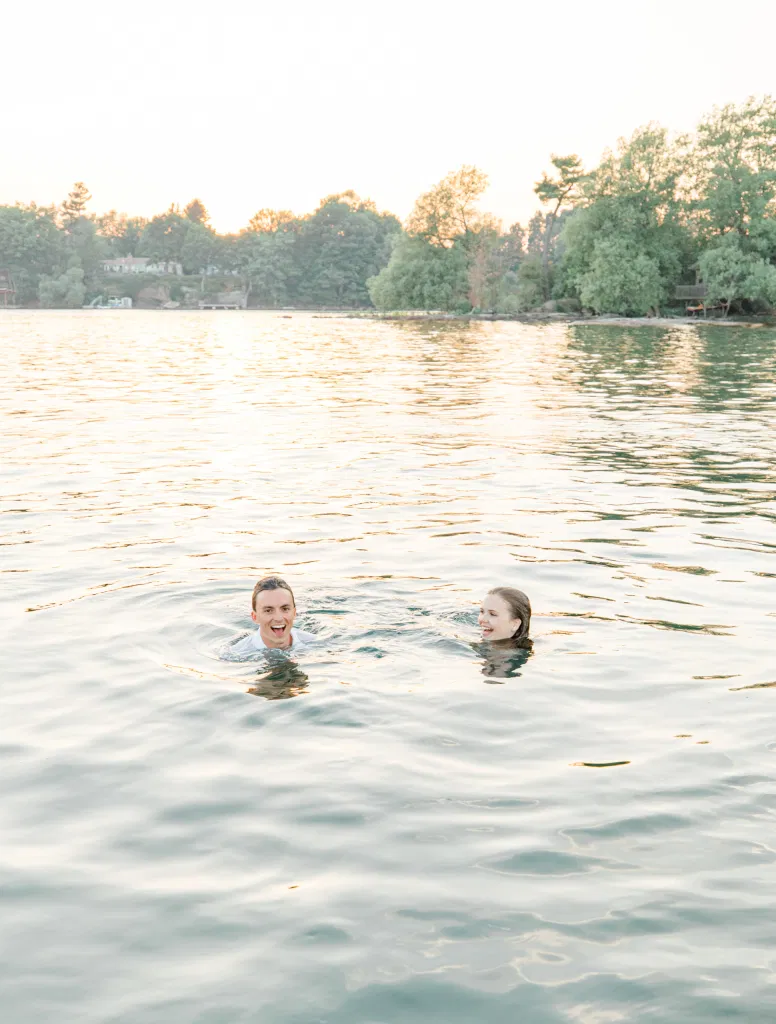 Boat Rides - Ideas for what to wear for Engagement Photography, Modern Engagement Session Inspiration Wardrobe Ideas. Unsure of what to wear for your engagement photos, we've got you! Romantic blue Romper and neutral Shirts and polo. Boat Shoes and Flip Flops. Engagement in Gananoque. Grey Loft Studio is Ottawa's Wedding and Engagement Photographer Videographer for Real couples, showcasing photos that are modern, bright, and fun.