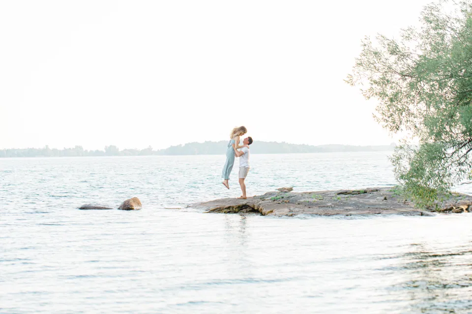 Ideas for what to wear for Engagement Photography, Modern Engagement Session Inspiration Wardrobe Ideas. Unsure of what to wear for your engagement photos, we've got you! Romantic blue Romper and neutral Shirts and polo. Boat Shoes and Flip Flops. Engagement in Gananoque. Grey Loft Studio is Ottawa's Wedding and Engagement Photographer Videographer for Real couples, showcasing photos that are modern, bright, and fun.