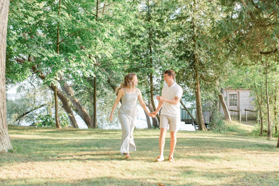 Ideas for what to wear for Engagement Photography, Modern Engagement Session Inspiration Wardrobe Ideas. Unsure of what to wear for your engagement photos, we've got you! Romantic blue Romper and neutral Shirts and polo. Boat Shoes and Flip Flops. Engagement in Gananoque. Grey Loft Studio is Ottawa's Wedding and Engagement Photographer Videographer for Real couples, showcasing photos that are modern, bright, and fun.
