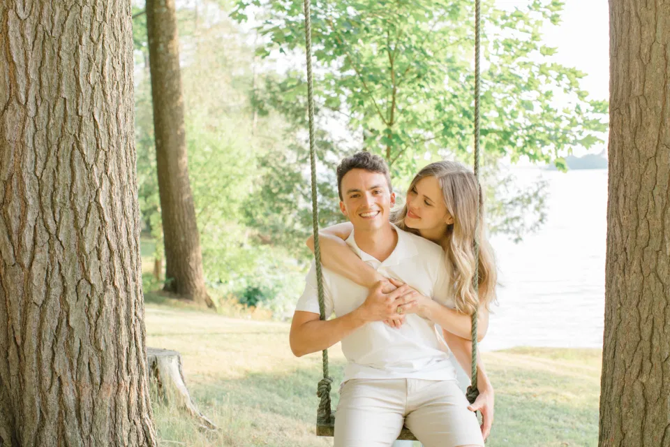 Swing Photo Ideas - Ideas for what to wear for Engagement Photography, Modern Engagement Session Inspiration Wardrobe Ideas. Unsure of what to wear for your engagement photos, we've got you! Romantic blue Romper and neutral Shirts and polo. Boat Shoes and Flip Flops. Engagement in Gananoque. Grey Loft Studio is Ottawa's Wedding and Engagement Photographer Videographer for Real couples, showcasing photos that are modern, bright, and fun.