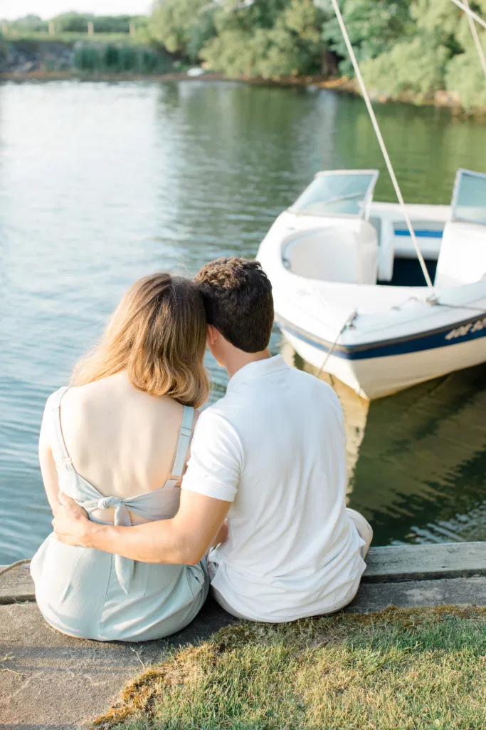 Ideas for what to wear for Engagement Photography, Modern Engagement Session Inspiration Wardrobe Ideas. Unsure of what to wear for your engagement photos, we've got you! Romantic blue Romper and neutral Shirts and polo. Boat Shoes and Flip Flops. Engagement in Gananoque. Grey Loft Studio is Ottawa's Wedding and Engagement Photographer Videographer for Real couples, showcasing photos that are modern, bright, and fun.