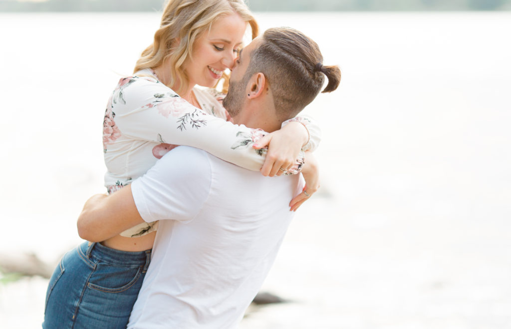 Walking on the Beach - Ideas for what to wear for Engagement Photography, Modern Engagement Session Inspiration Wardrobe Ideas. Unsure of what to wear for your engagement photos, we've got you! Romantic floral shirt & jeans.  White T-shirt & neutral pants . Boat Shoes and Fancy. beaded sandals. Engagement at Petrie Island, Orleans. Grey Loft Studio is Ottawa's Wedding and Engagement Photographer Videographer for Real couples, showcasing photos that are modern, bright, and fun.