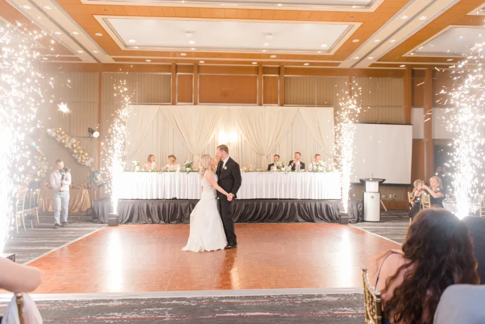 First Dance Goals - First Dance indoor Fireworks - NYE Wedding - Natural Wedding Posing - Ideas for what to wear for Wedding on NYE Photography, Modern Wedding NYE Wardrobe inspiration- Must Have photo at Midnight - Unsure of what to wear for your wedding, we've got you! Romantic white with greenery theme. Lace Wedding Dress in Ottawa. Grey Loft Studio is Ottawa's Wedding and Engagement Photographer for Real couples, showcasing photos that are modern, bright, and fun.