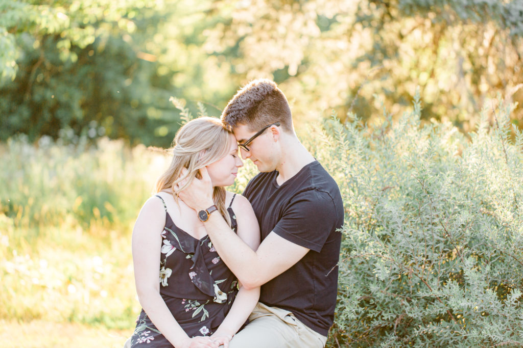Cute Posing for Tall guys with short girls - Holding Hands Shot - Engagement Photo Poses- Posing while at Rideau Hall - Ideas for what to wear for Engagement Photography, Modern Engagement Session Inspiration Wardrobe Ideas. Unsure of what to wear for your engagement photos, we've got you! Romantic floral dress. Black Polo T-shirt & neutral pants . Boat Shoes and Fancy beaded wedges. Engagement downtown Ottawa. Grey Loft Studio is Ottawa's Wedding and Engagement Photographer Videographer for Real couples, showcasing photos that are modern, bright, and fun.