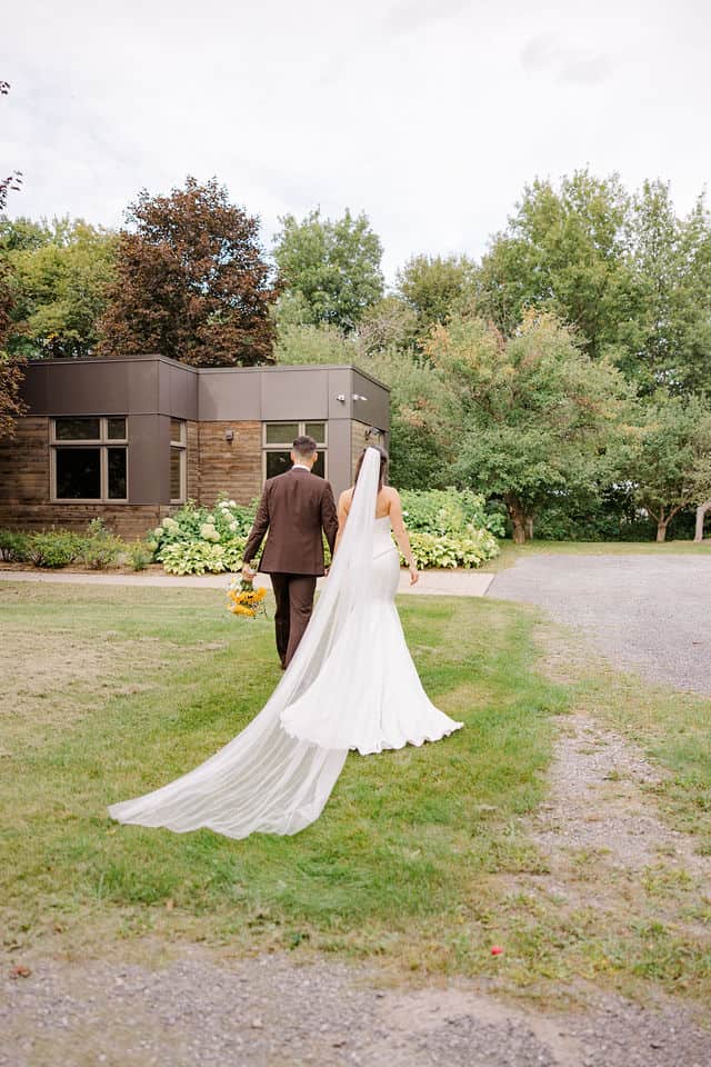 Julia and Will walking back toward the cidery building