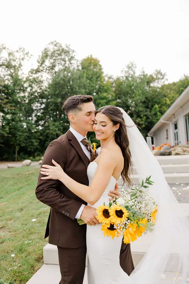 Will kissing Julia's forehead while she holds her sunflower bouquet