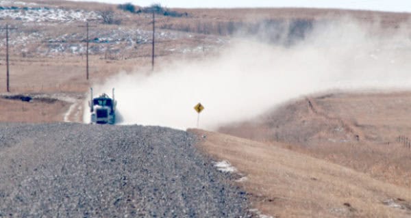 dusty-gravel-road-and-oil-truck