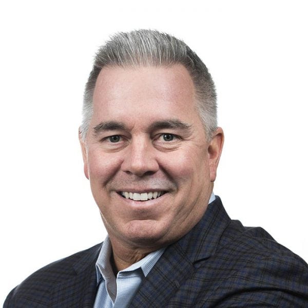 Headshot of Brendan Friar smiling against white backdrop