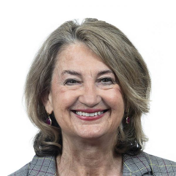 Headshot of Marge Ackermann smiling against white backdrop