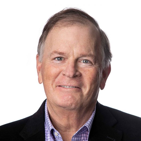 Headshot of Rich Sikes smiling against white backdrop
