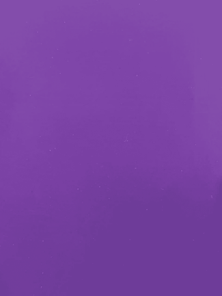 Solid purple background with a subtle texture and a few small white specks