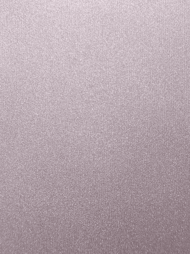 Close up of a pink metallic glittery surface with fine sparkles