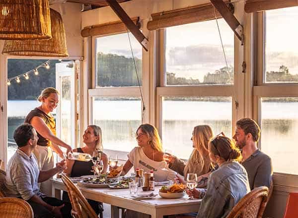 A group of people dining at Quarter Deck in Narooma, NSW