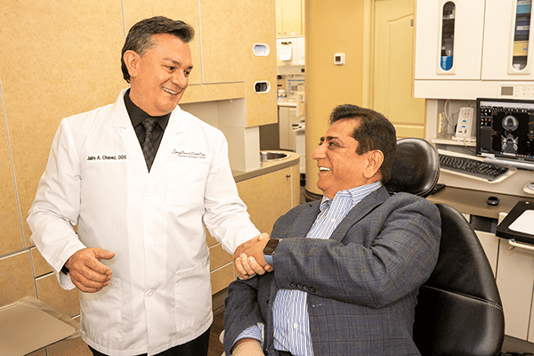 Dr. Chavez shakes hands with a patient