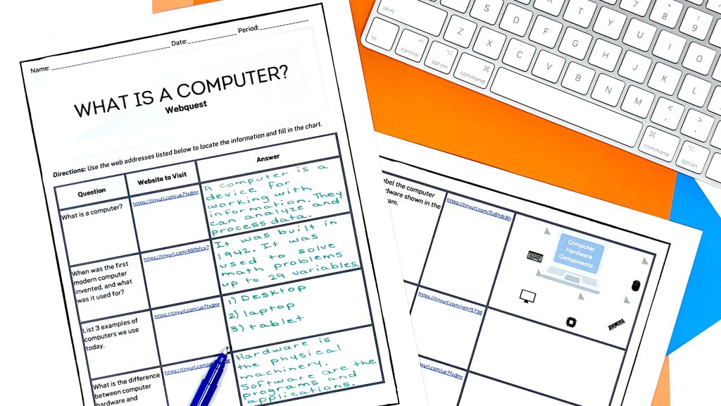This image shows a worksheet titled "What is a computer?" webquest. The worksheet has questions such as, "When was the first modern computer invented, and what was it used for?" The worksheet is partially completed. A pen lies on top and a keyboard is pictured in the corner.