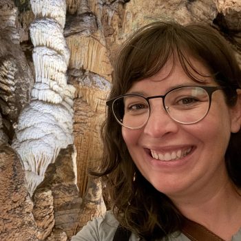 This image shows a picture of Trilby, author of STEM in the Middle, near a rock formation.
