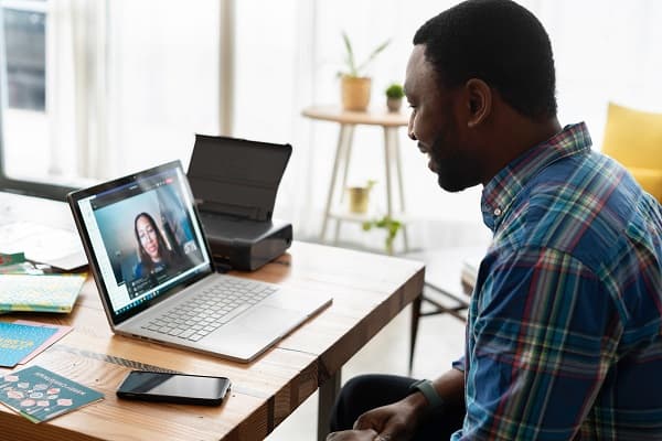 Person working on a laptop, representing virtual assistant services.