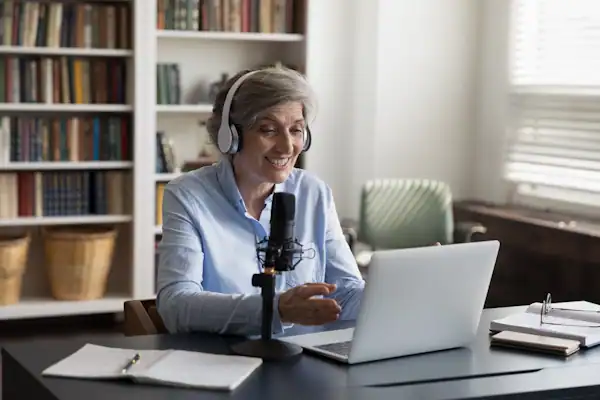 Lady working from home using essential tools as a business coach