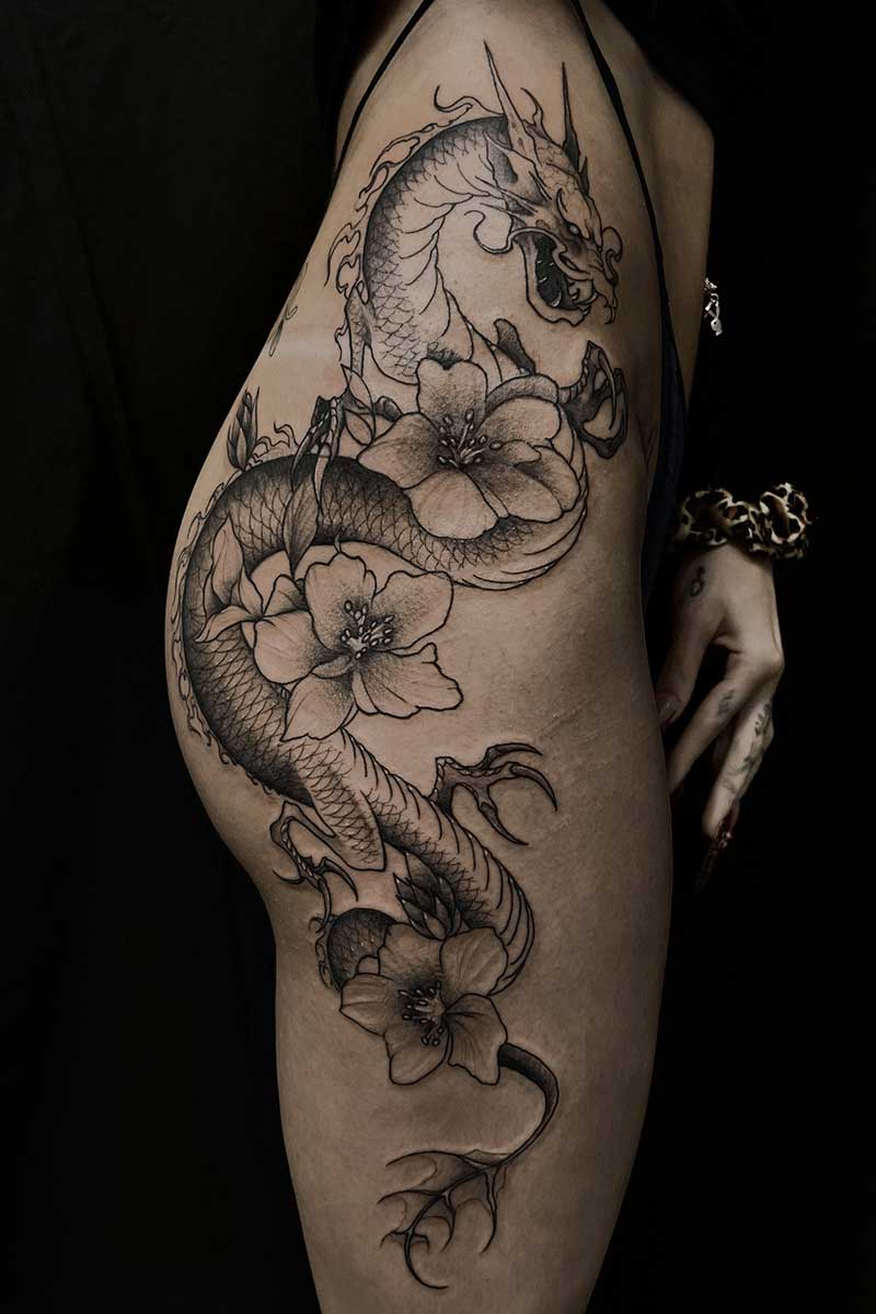 Black grey tattoo dragon flowers by Brandon
