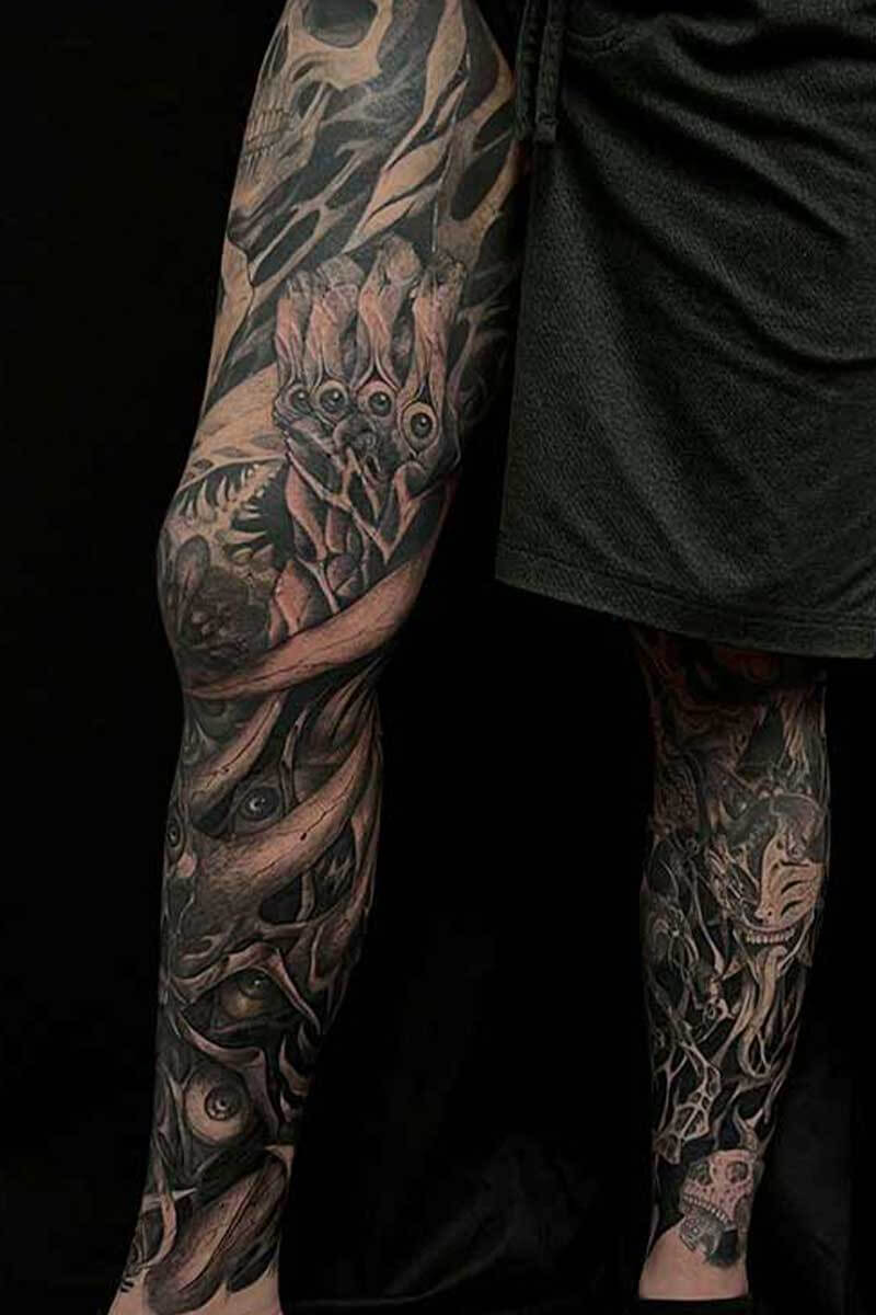 Dark art tattoo leg sleeve by Brandon