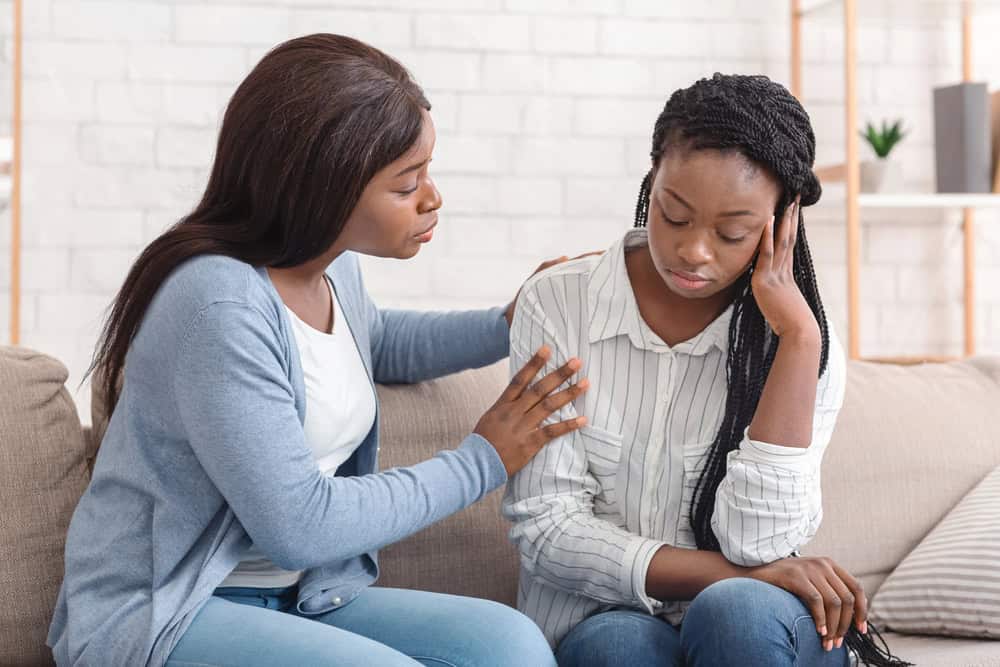 Counselling session with a young abused woman and her counsellor