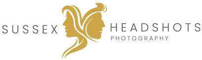 Elegant professional headshot of a person in a studio setting, showcasing confident business attire for Sussex Headshots.