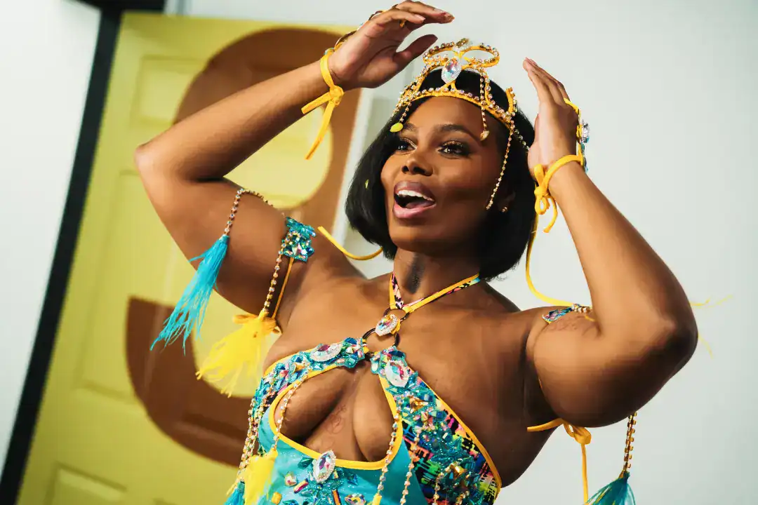 Beautiful woman in vibrant carnival costume with decorative accessories and headpiece, celebrating culture and festivities, colorful fashion for events or performances.
