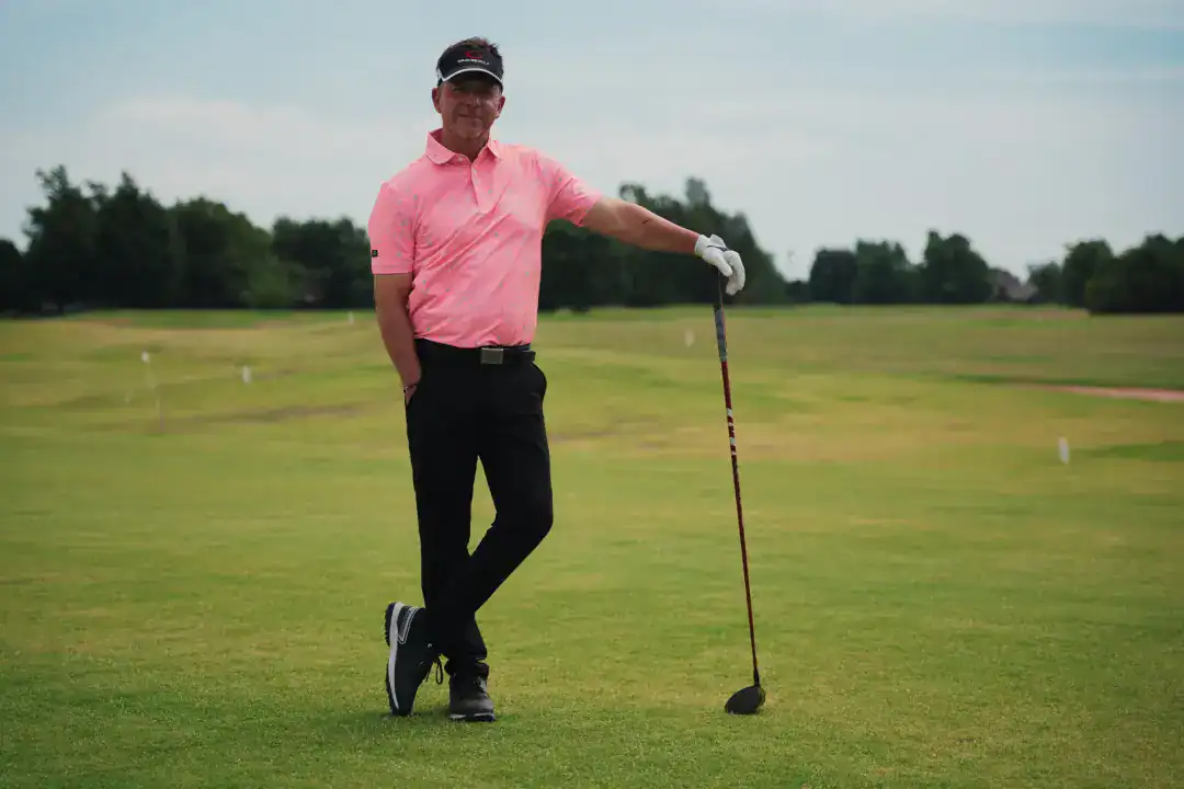 Golf enthusiast on a well-maintained golf course, showcasing leisure and sports lifestyle.