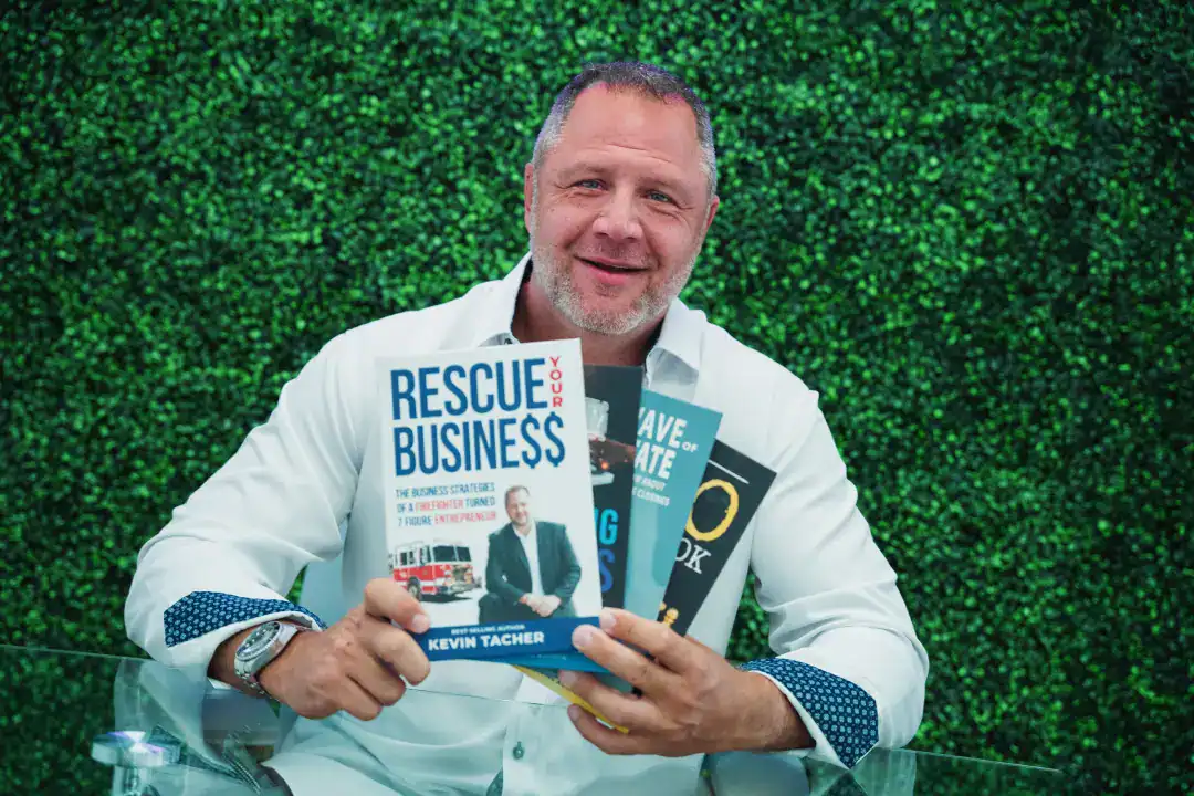 Rescue Business book by Kevin Tacher, entrepreneur, with other business strategy books, suggesting leadership and business growth.