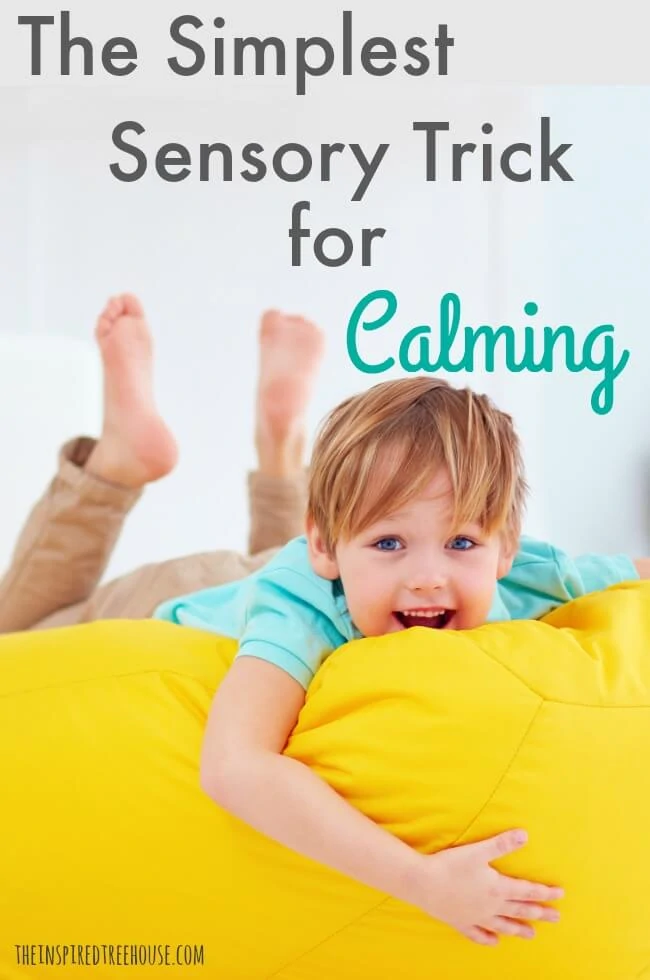 Child lying on a yellow bean bag getting deep pressure input with text that reads The Simplest Sensory Trick for Calming