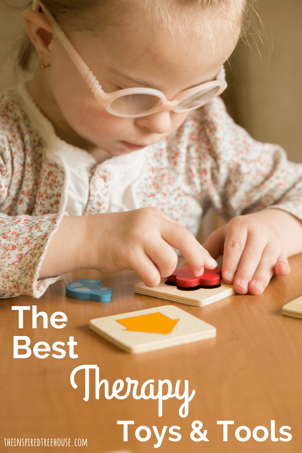child playing with therapy toys