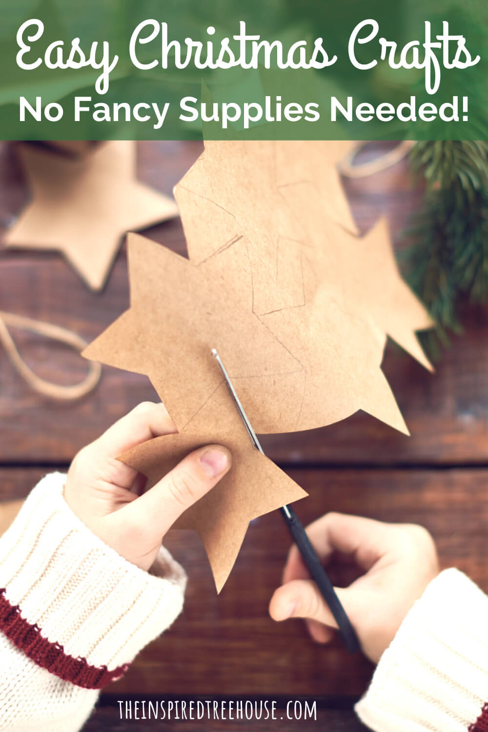 kids hands cutting out paper stars