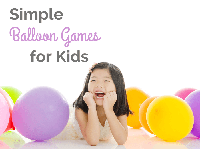 little girl smiling with balloons