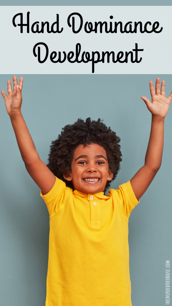 hand dominance development - child with both hands in the air