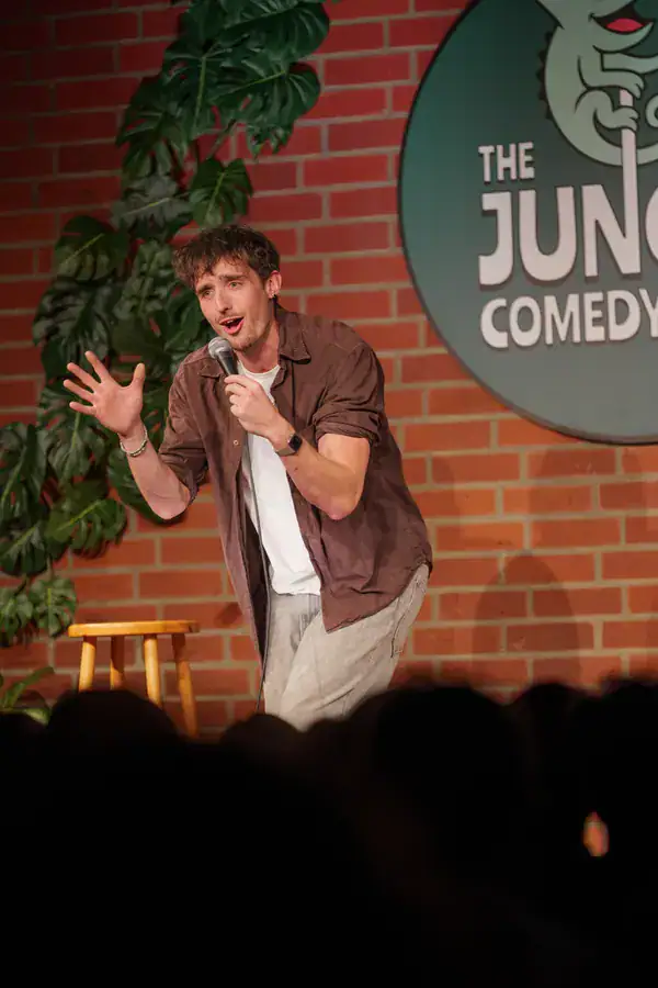 Comedian telling a story at the Jungle Comedy Showcase