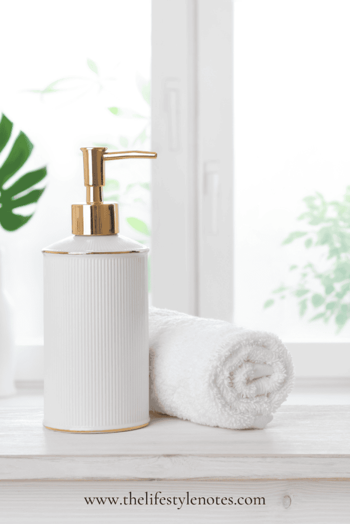 Why is Clean Beauty Important? Pump bottle with towel on white vanity.