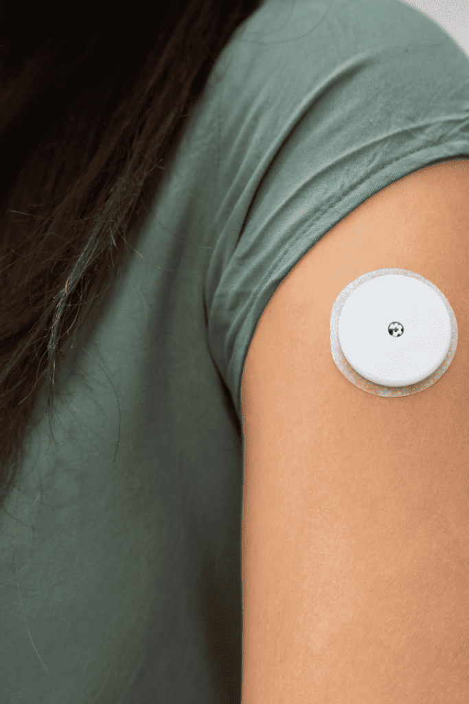 How Blood Sugar Balance Has Changed the Way I Eat. Woman's arm with glucose monitor.