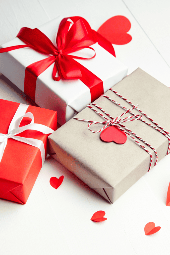 Valentine's Day Gifts for Kids. Packages wrapped with red ribbon and hearts.