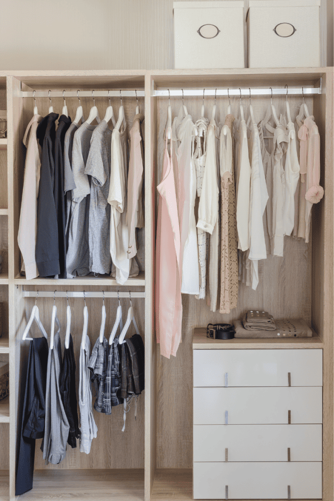 Five Simple Steps for Spring Cleaning Your Closet. Closet with clothes neatly hung.