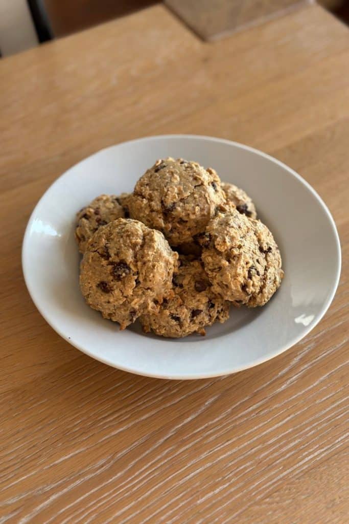 Gluten Free Breakfast Cookies. White plate with 6 breakfast cookies.
