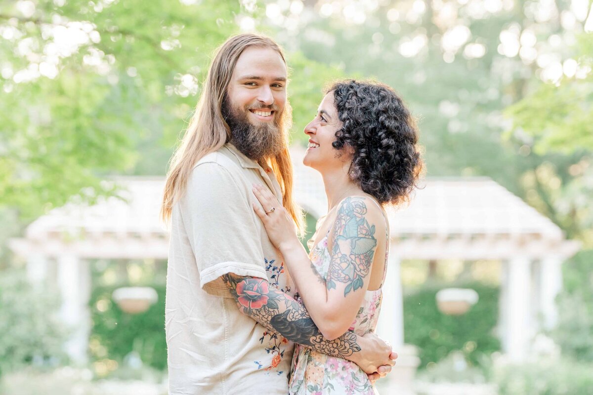 Engaged couple exploring the botanical gardens at Daniel Stowe Conservancy